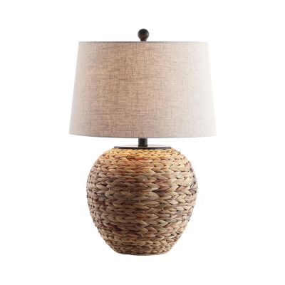 A woven seagrass table lamp in a Serena and Lily Dupes shopping guide