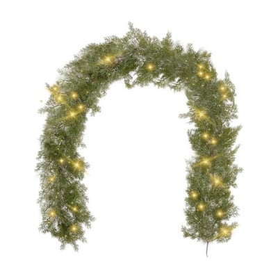 A cedar garland with lights on a white background.