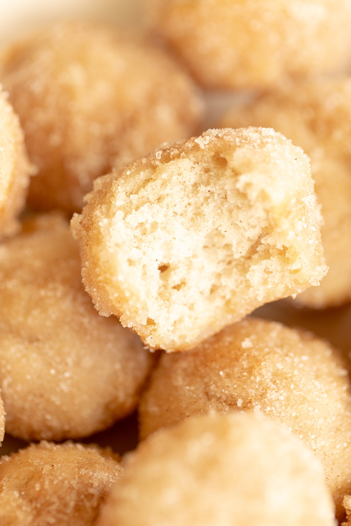 Close up of mini cinnamon muffins, rolled in cinnamon sugar.