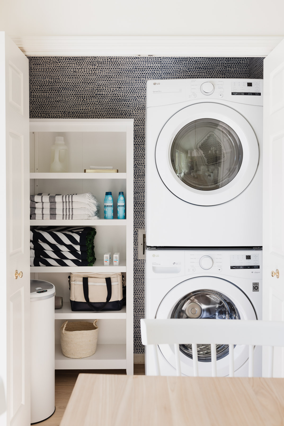 laundry closet with stackable washer and dryer
