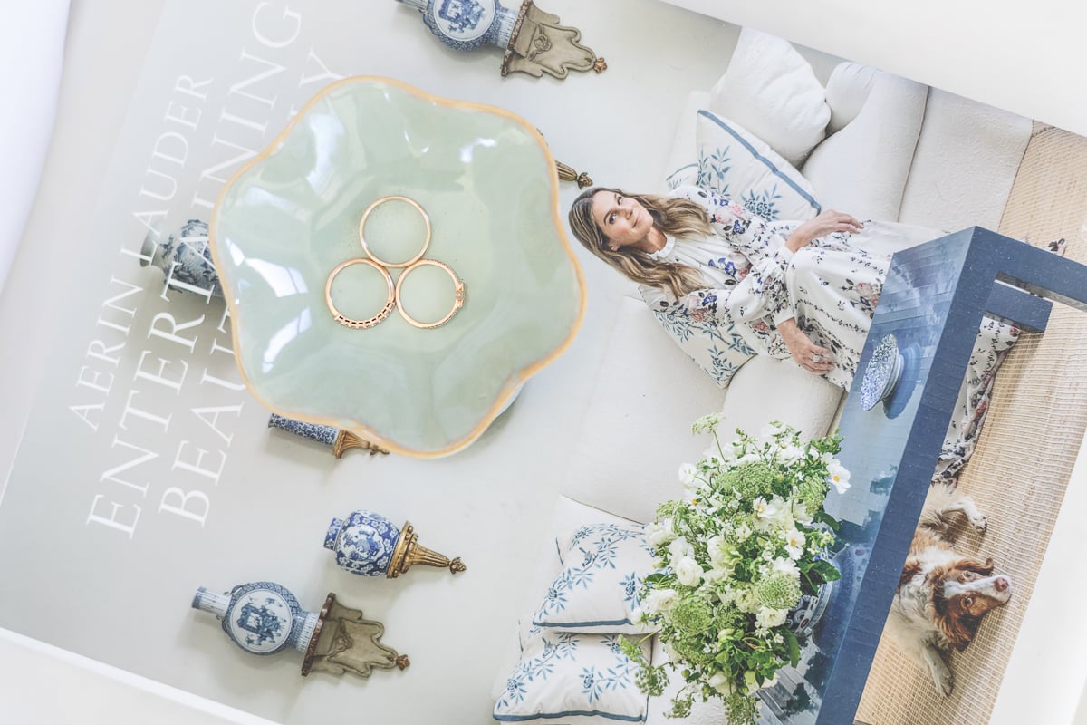 coffee table book with green trinket dish and 3 rings