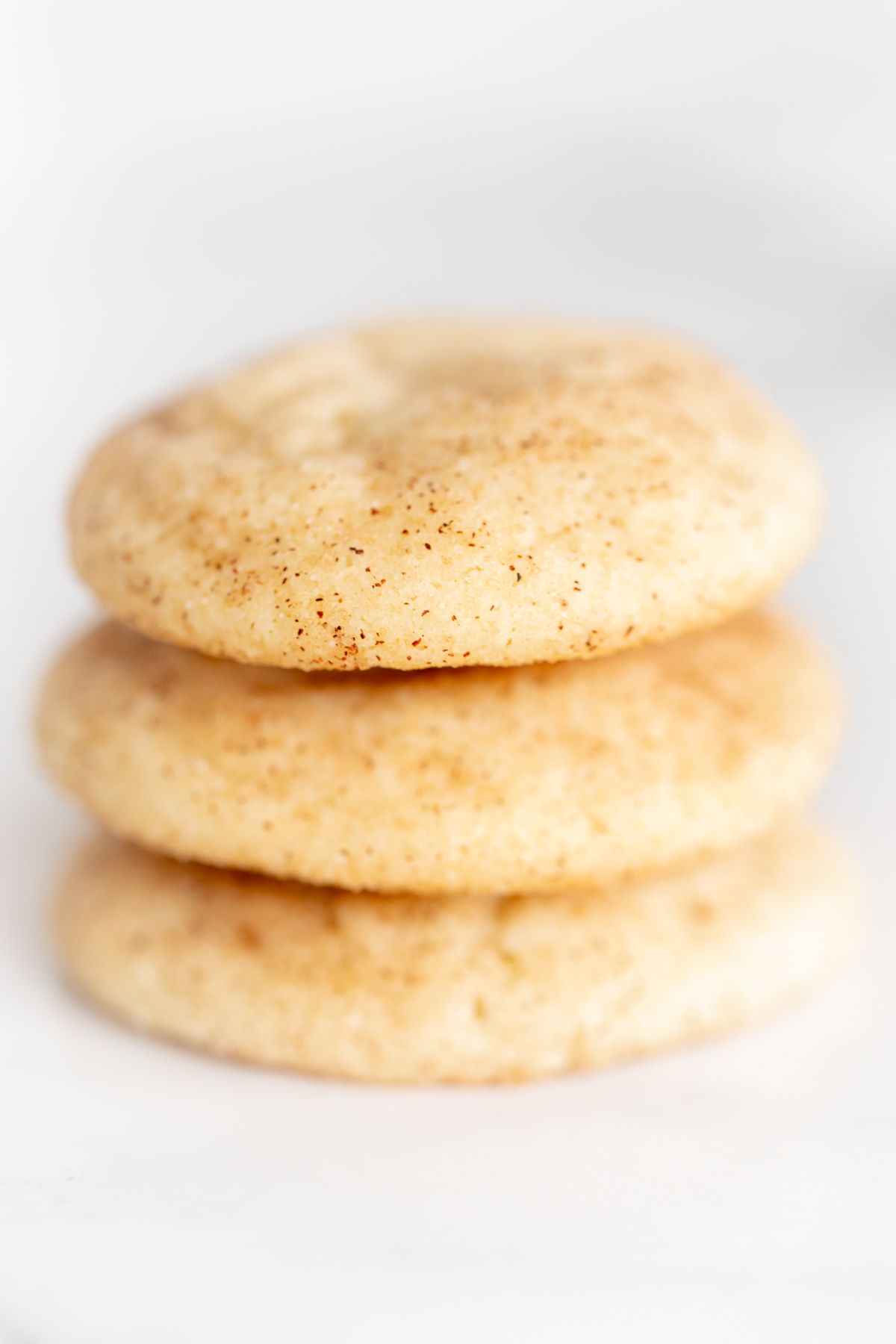 snickerdoodle christmas cookies on a white surface.