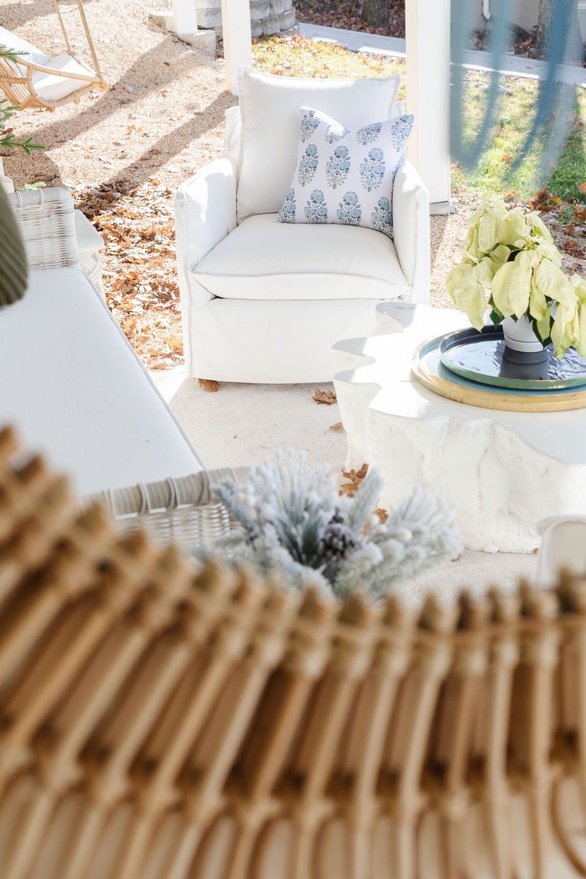 A patio decorated for the holidays with a coastal Christmas decorating style.