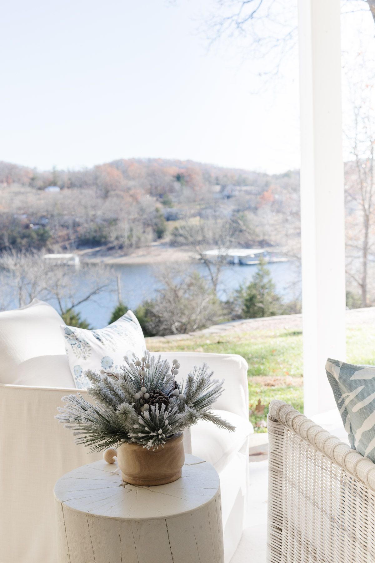 A patio decorated for the holidays with a coastal Christmas decorating style.