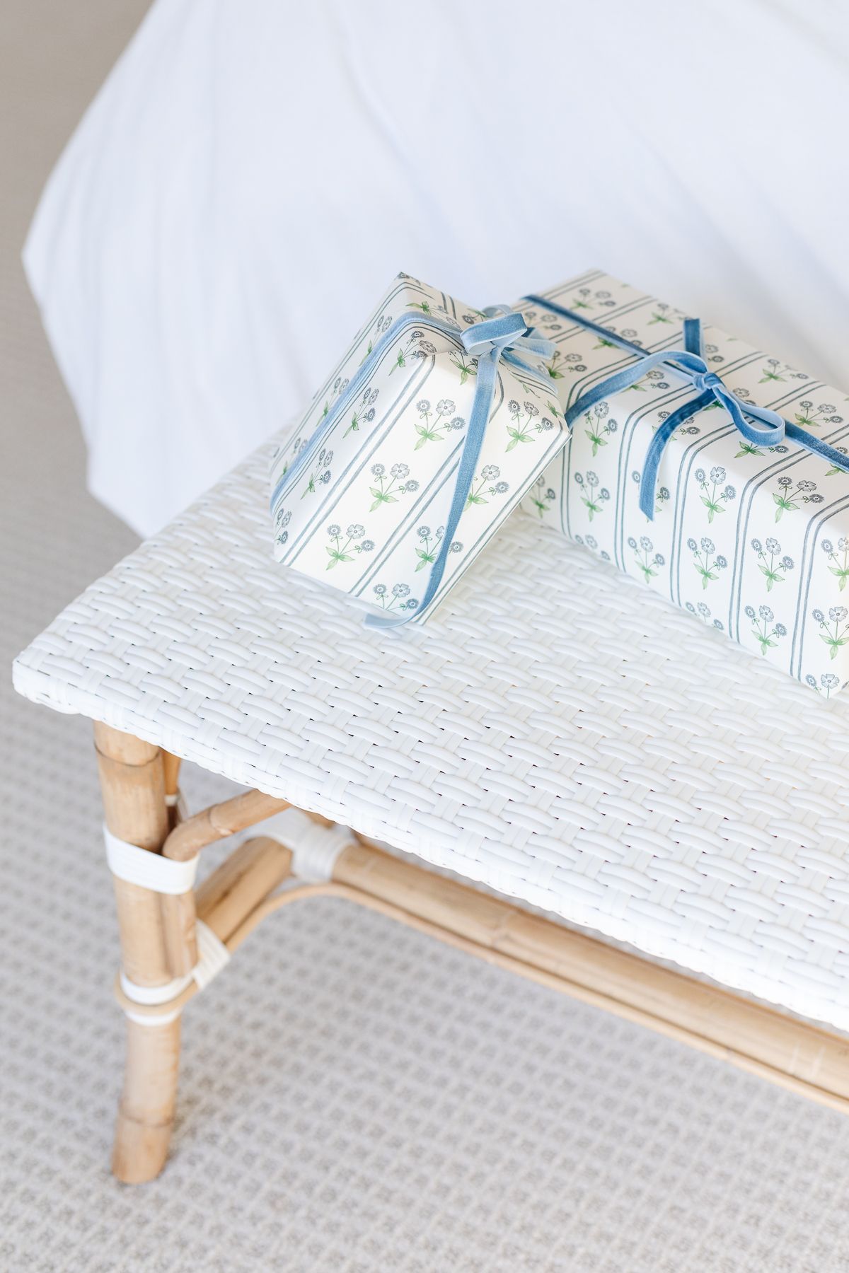 A blue and white wrapped package on a stool for a coastal Christmas.