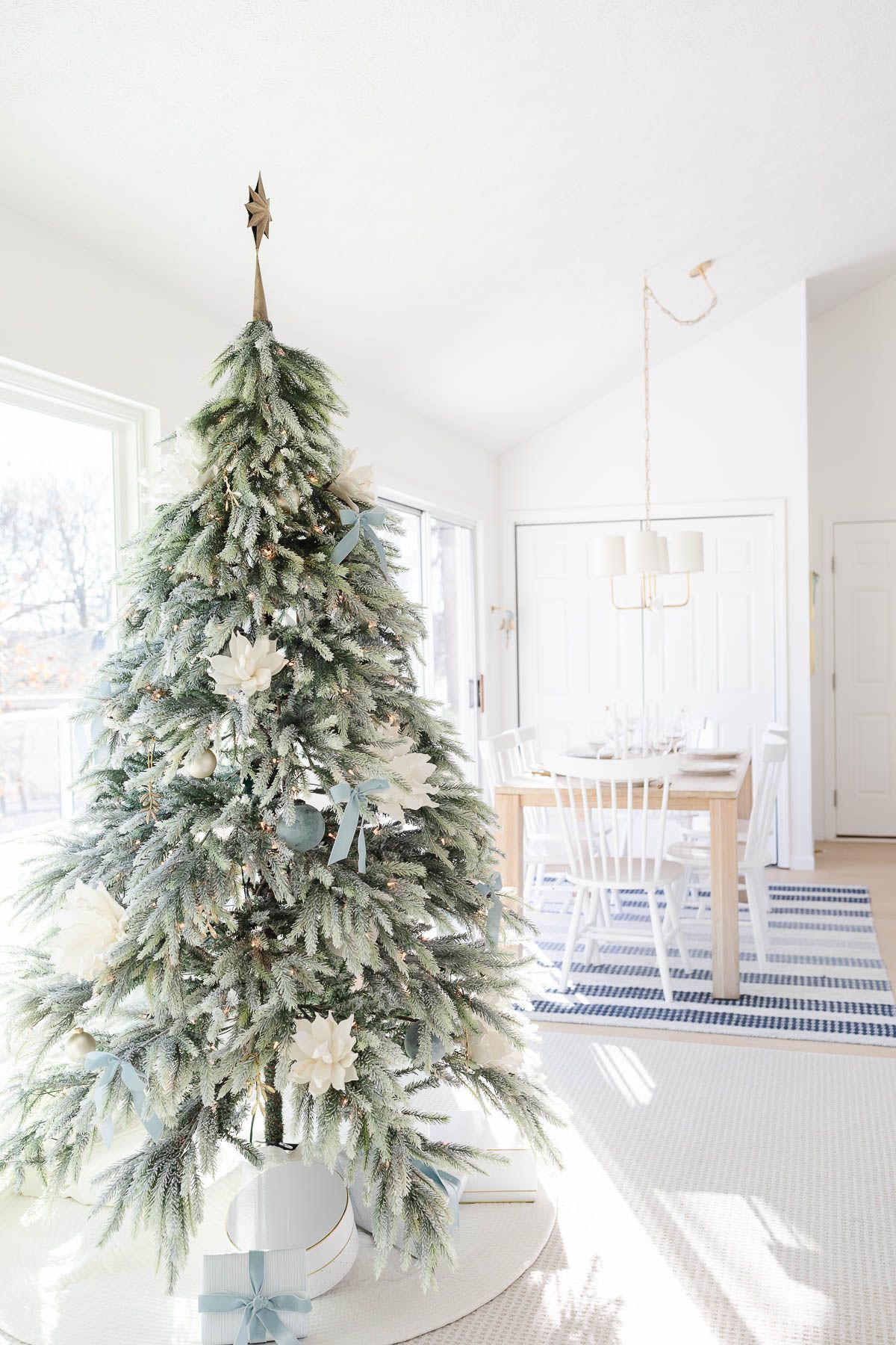 A coastal Christmas tree in a white living room.
