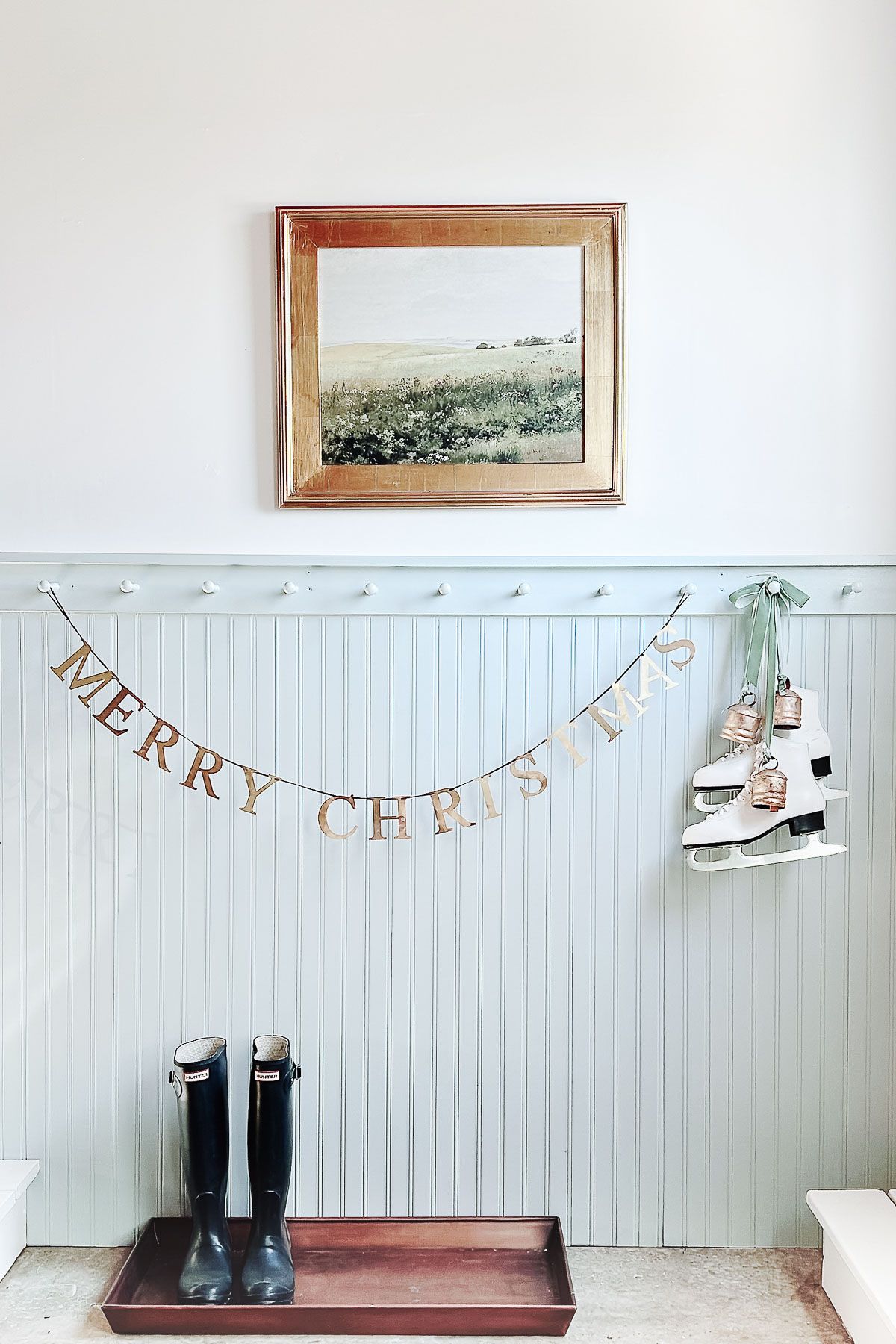 A blue beadboard garage space, decorated for Christmas