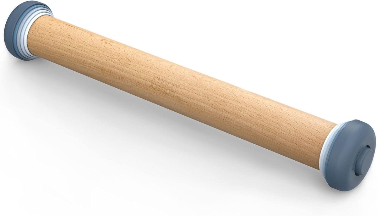 A blue handle wooden stick on a white surface.