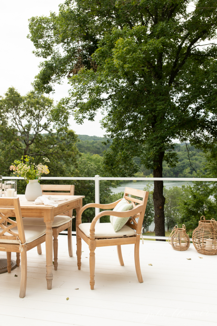 ceylon teak furniture on white deck with glass railing