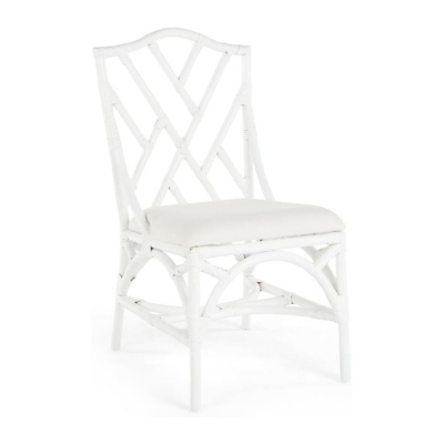 A white rattan dining chair with a white cushion available on Amazon.