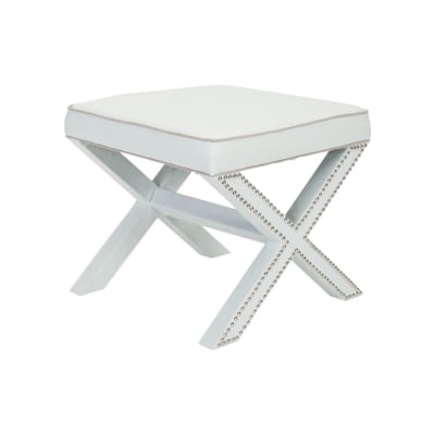 A white stool with studded legs available on Amazon.