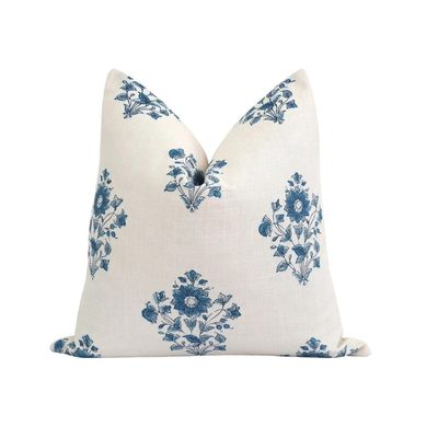 A blue and white block print pillow 