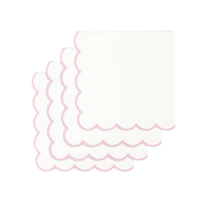 Four white napkins with scalloped pink trim.