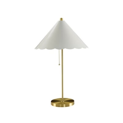 A white table lamp with a scalloped gold base.