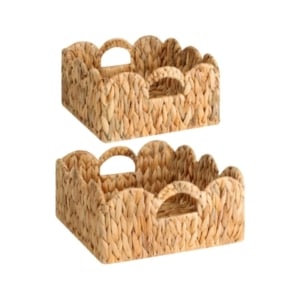 A pair of wicker baskets with scalloped decor.
