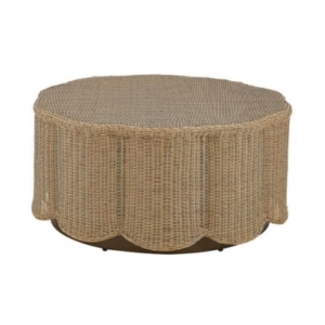 A round wicker coffee table with a scalloped metal base.