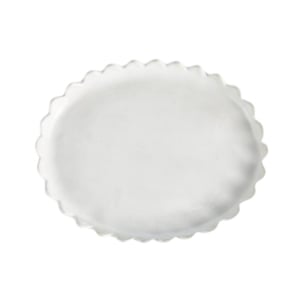 A white plate with scalloped decor on a white background.