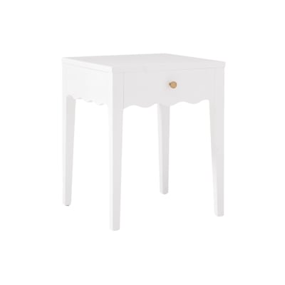 A white table with scalloped decor and a drawer.