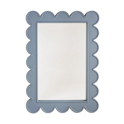 A blue scalloped decor mirror on a white background.