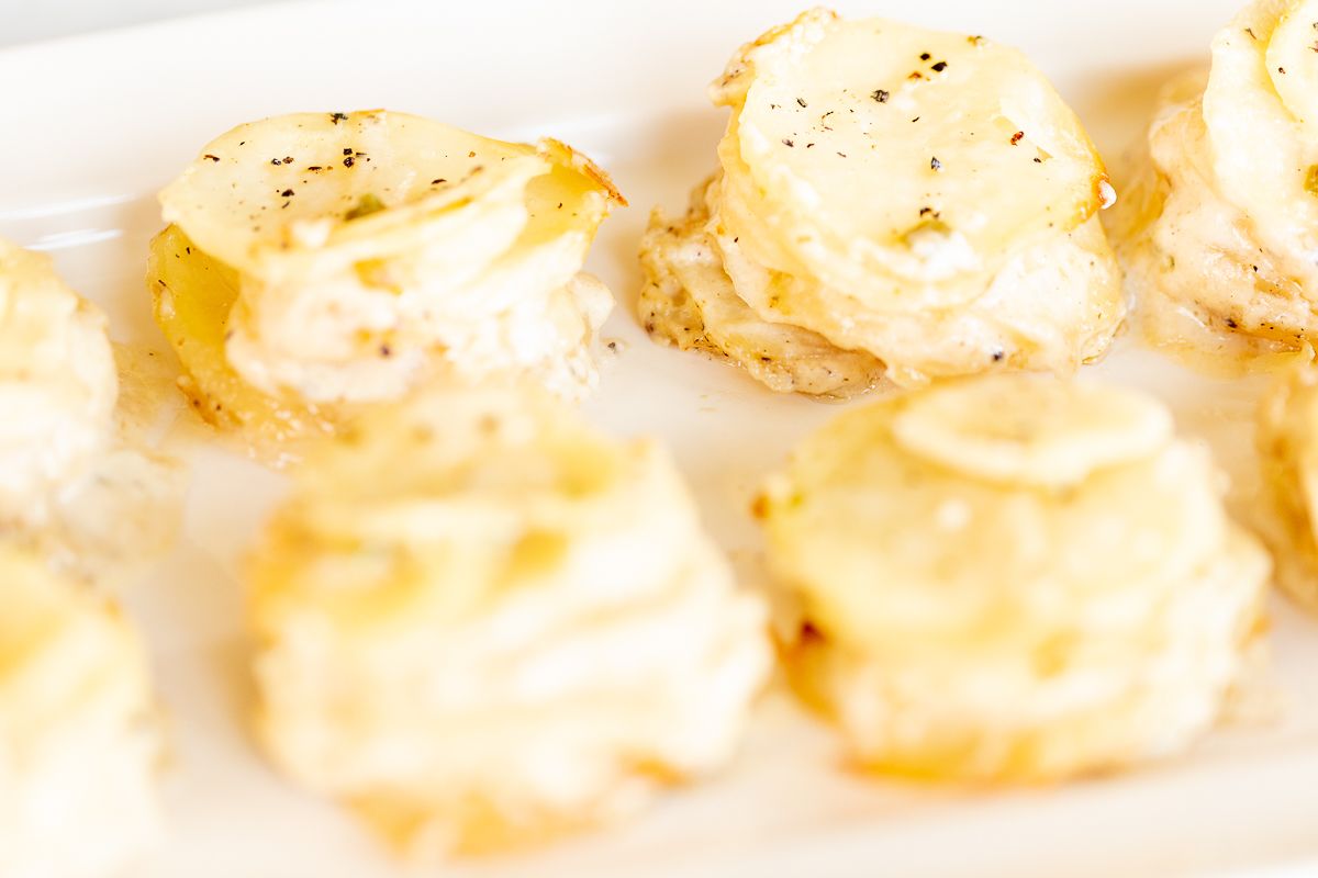 gratin potato stacks on a white plate