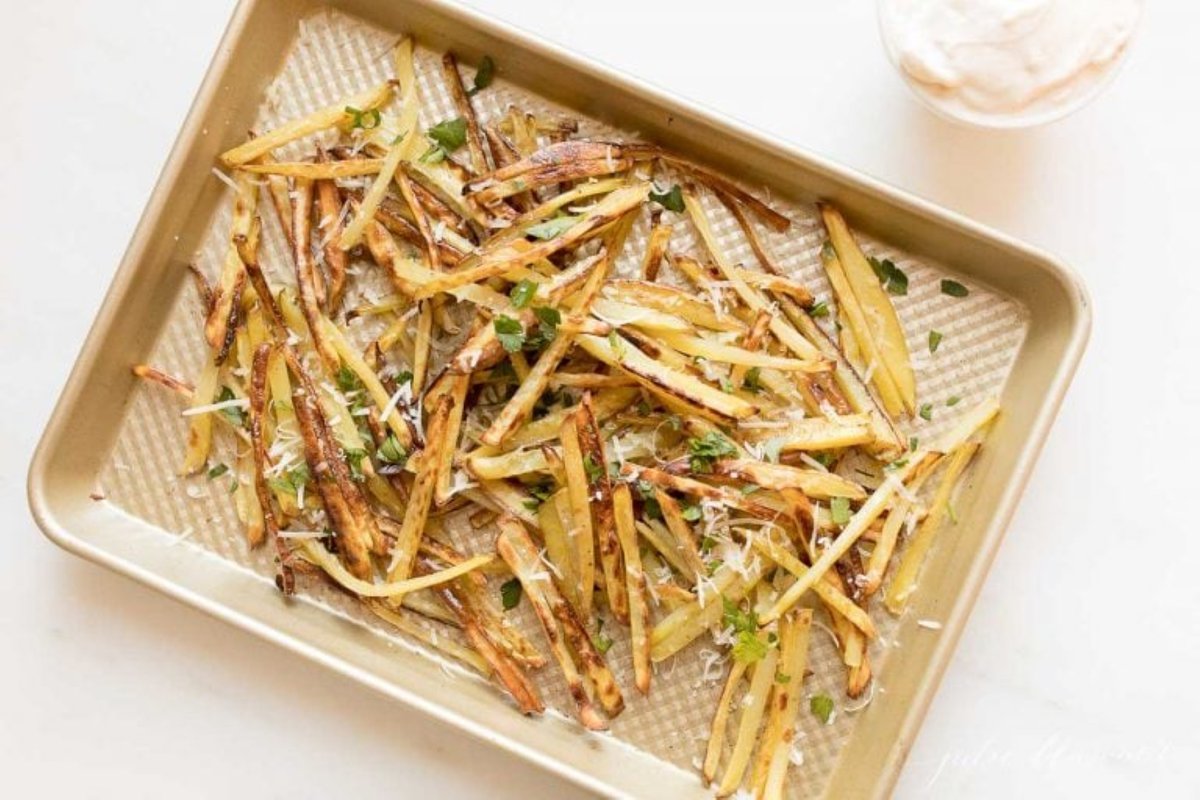 gourmet fries with Parmesan and parsley on a sheet pan