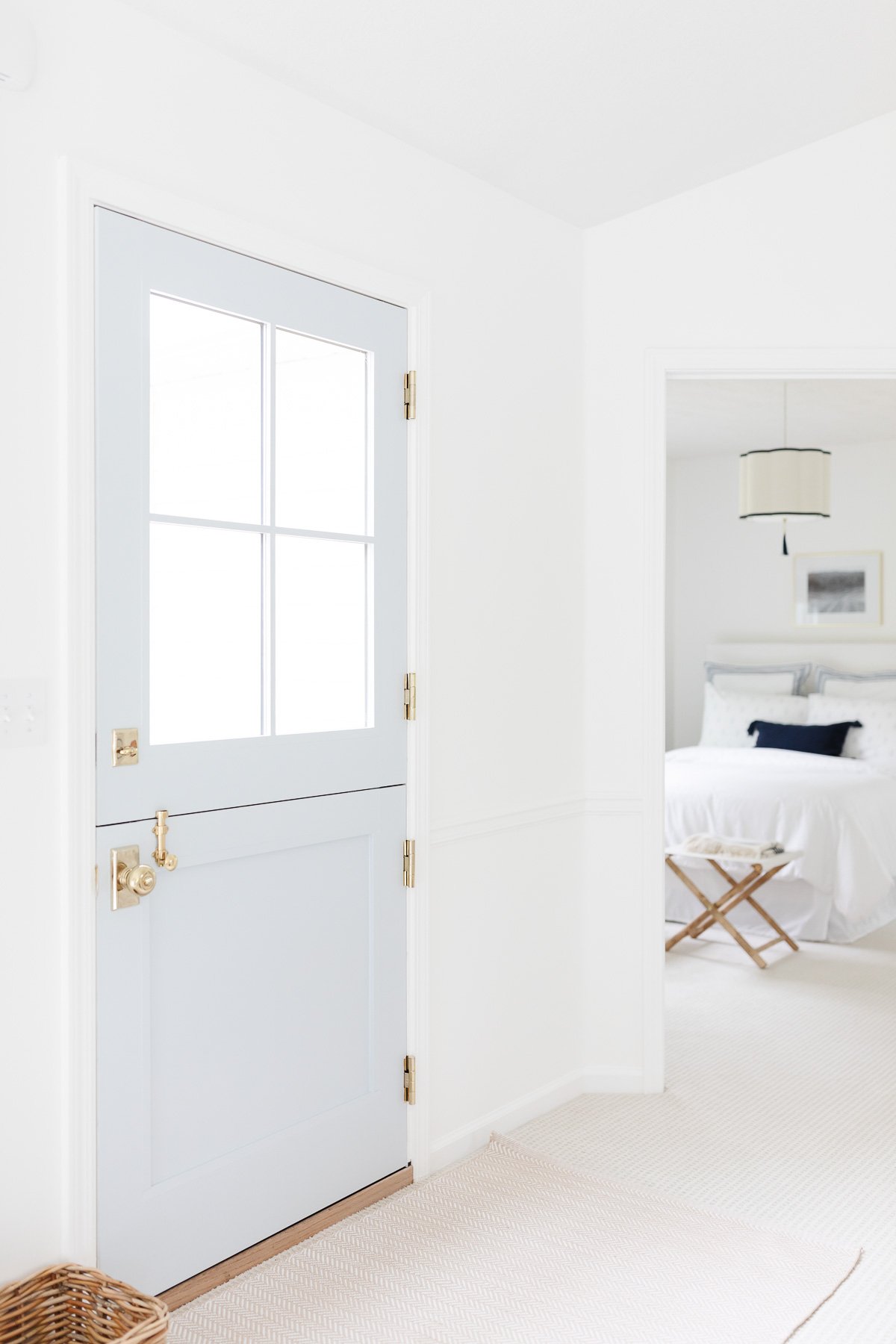 warm white walls and trim same color with blue door
