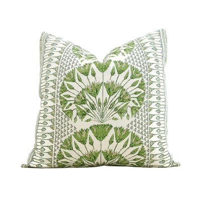 A green and white Amazon pillow cover.