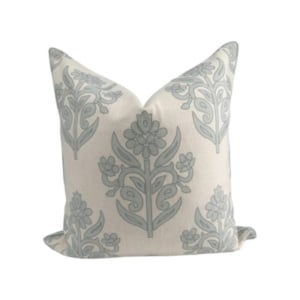 A floral design pillow perfect for adding a touch of elegance to your decor.