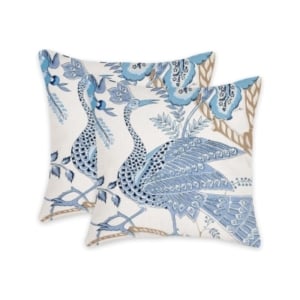 A pair of blue and white pillows with birds on them, ideal for Amazon pillow covers enthusiasts.