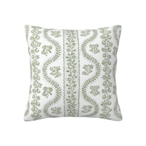 A green and white pillow with a floral pattern can be found on Amazon.