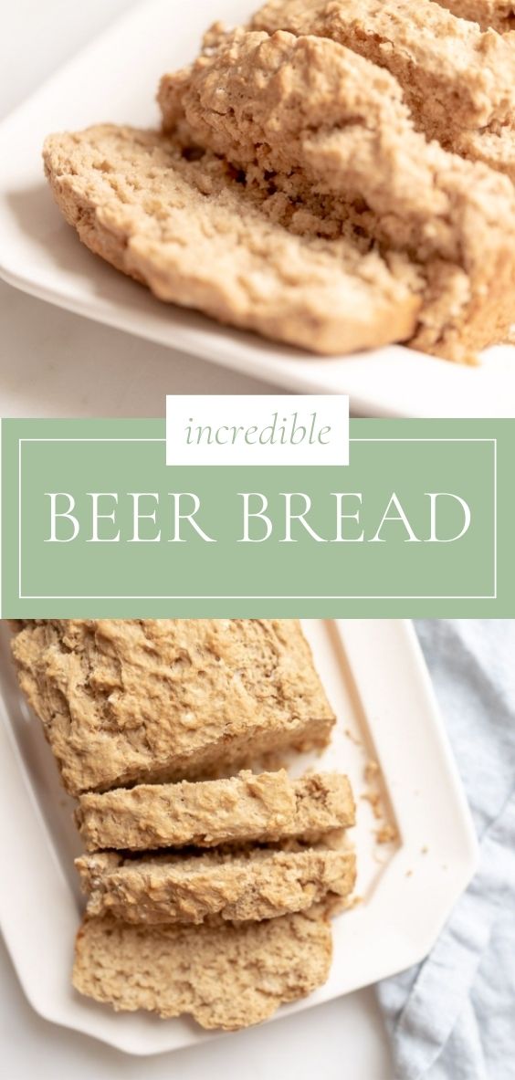 Beer Bread is displayed on a white platter on top of a marble counter next to a blue napkin.