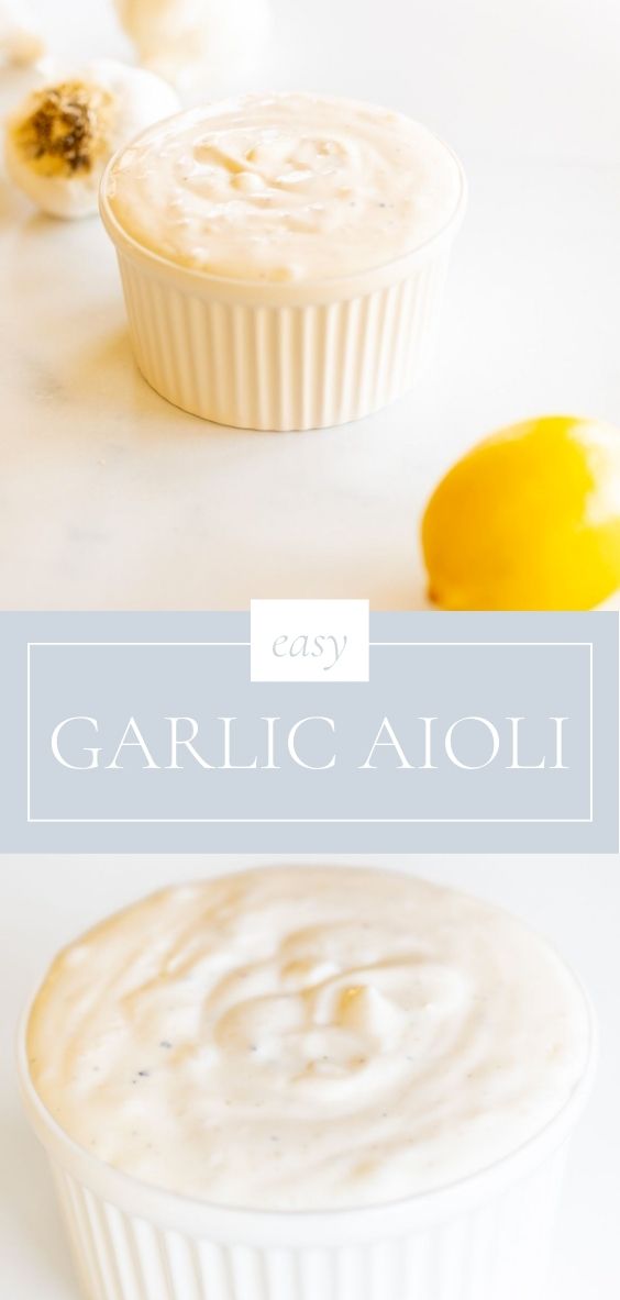 A fresh whole lemon and garlic are next to garlic aioli in white bowls