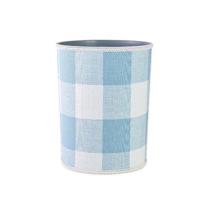 a blue and white checked waste paper basket