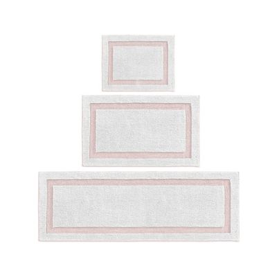 Pink and white bath mats