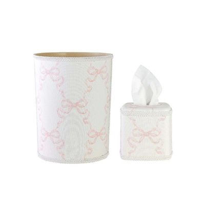 a pink and white waste basket and tissue box cover