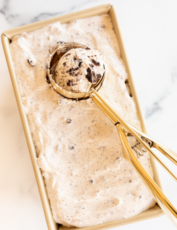 Ice cream scooper in pan of no-churn cookies and cream ice cream