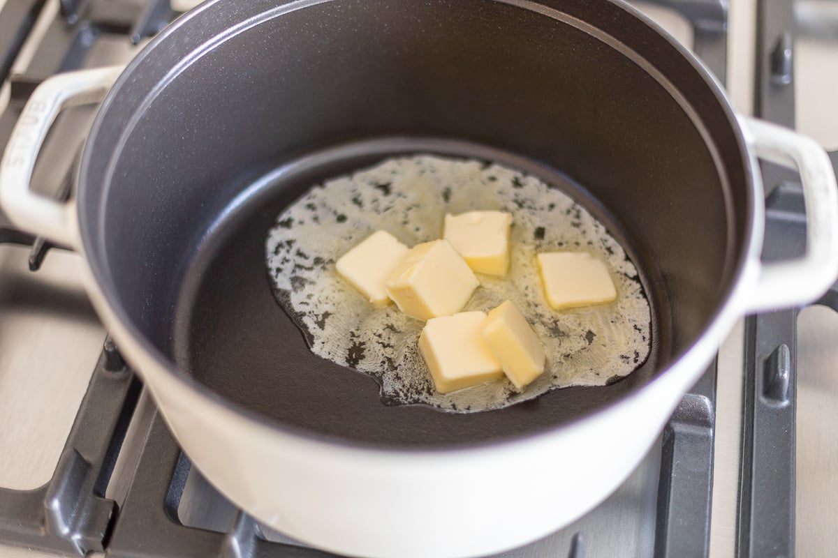 Butter melting in Dutch oven set on stovetop
