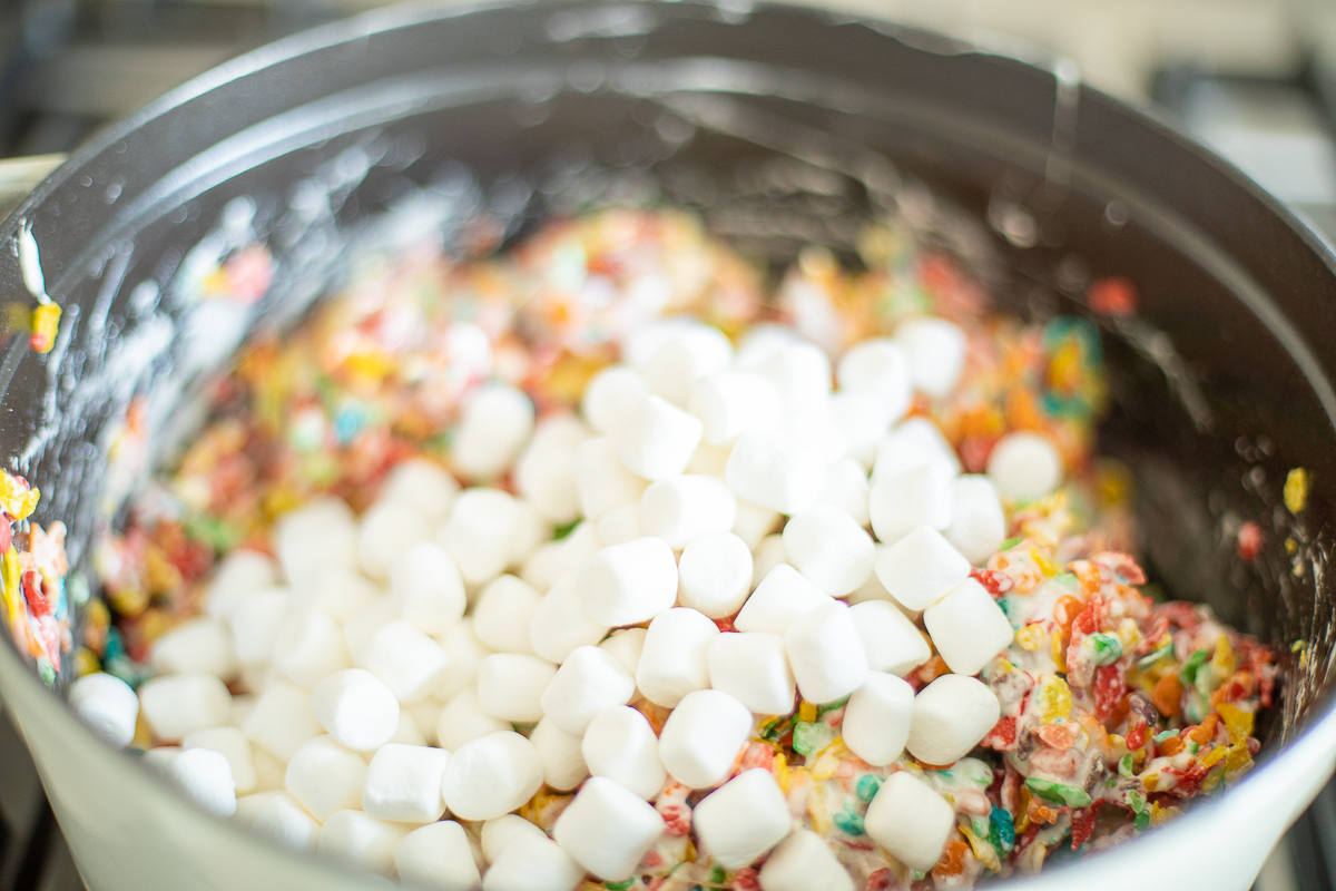 Mini marshmallows added to Fruity Pebbles Treat mixture