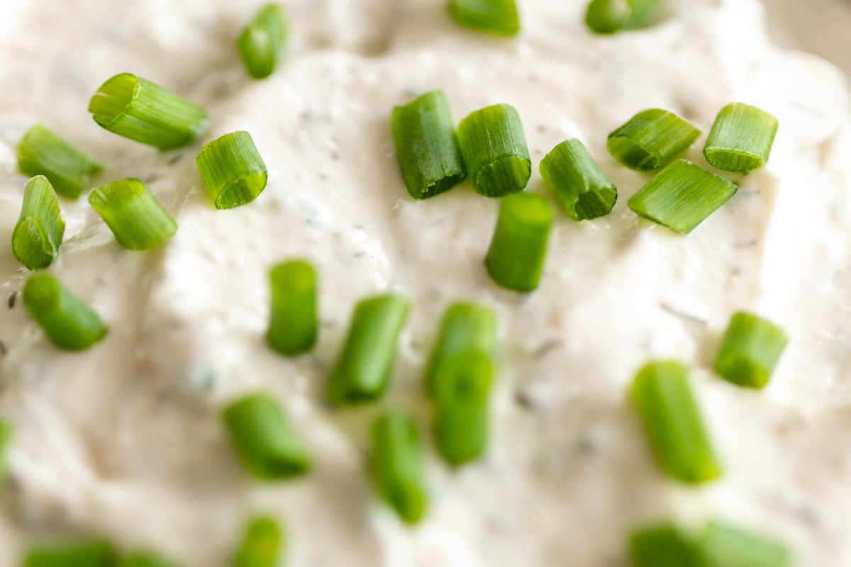 Closeup of homemade ranch dip topped with fresh chives