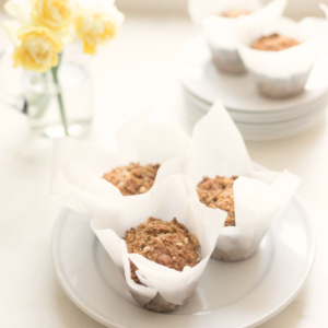 Banana muffins on a white plate, in a collection of best banana recipes.