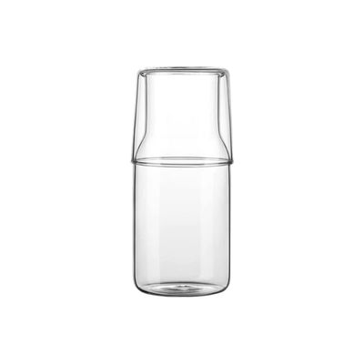 a glass carafe with a lid