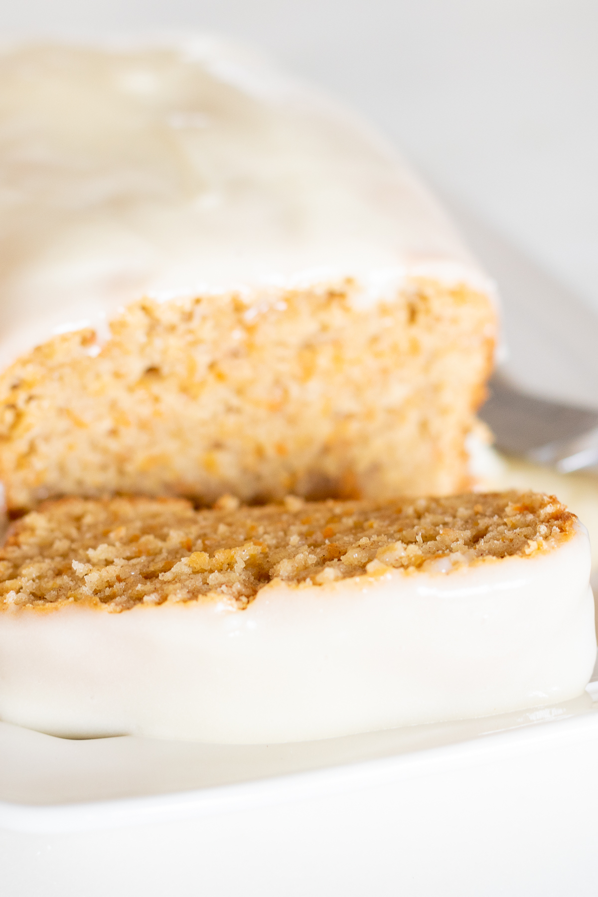 A carrot cake loaf topped with cream cheese glaze