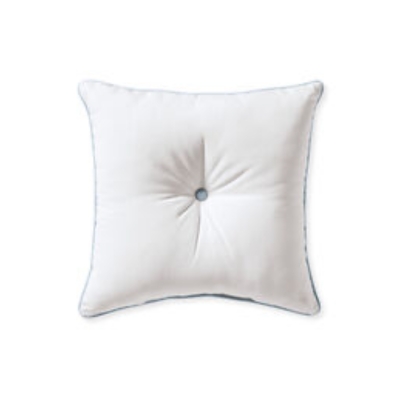 A white outdoor pillow with blue edging