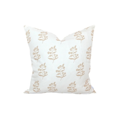A cream patterned outdoor pillow