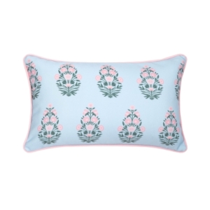 An outdoor light blue pillow with pink flowers on it.