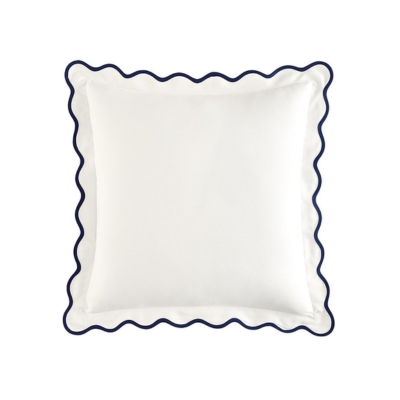 a white outdoor pillow with blue scalloped edging