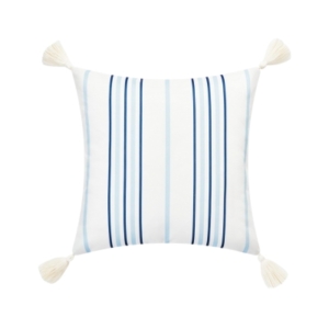 An outdoor blue and white striped pillow with tassels.