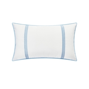 A white and blue outdoor pillow with a blue stripe.
