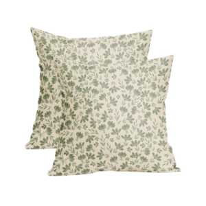 A pair of green and white floral outdoor pillows on a white background.