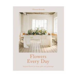 Book cover for "Flowers Every Day" by Florence Kennedy, perfect for fans of decorative books, featuring a floral arrangement on a wooden table in a bright, sunlit room with large windows.